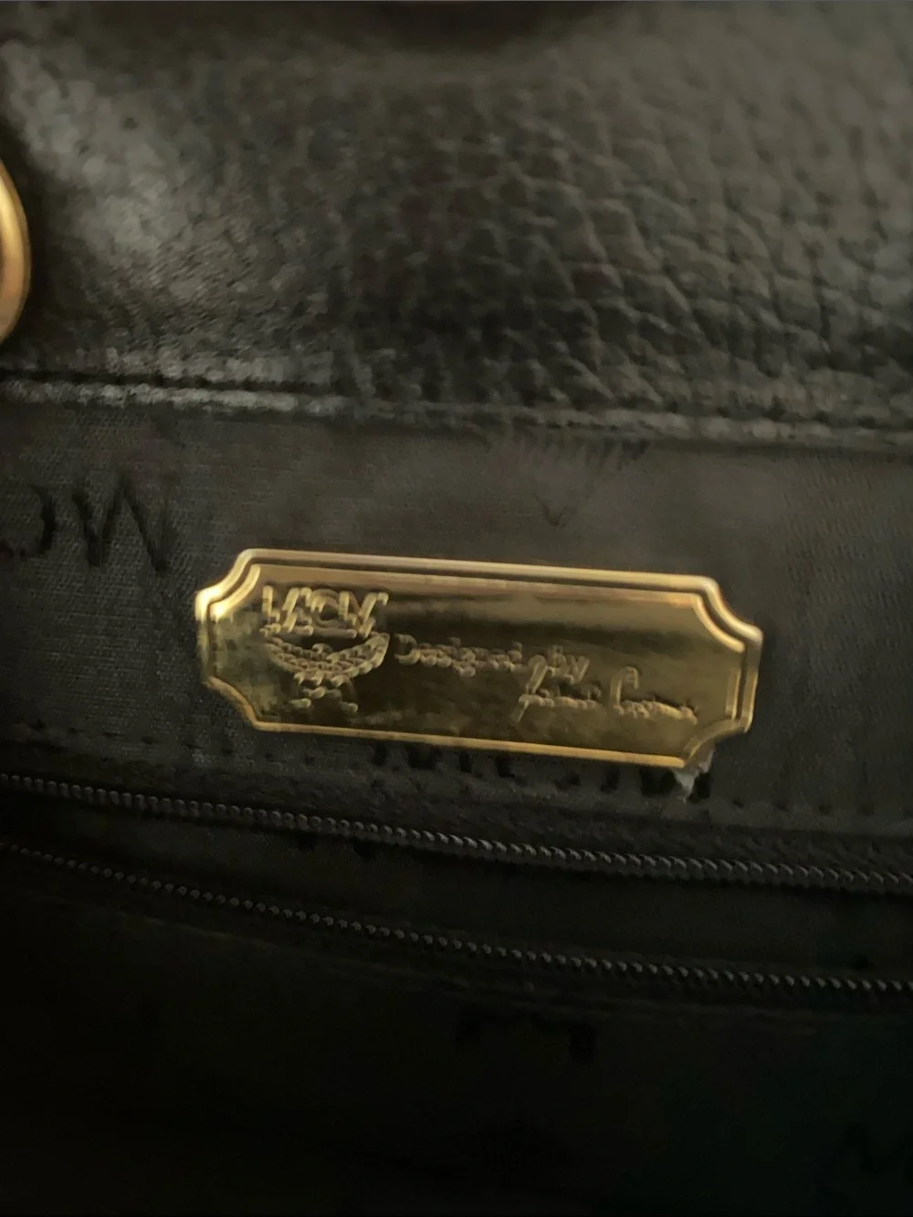 MCM Black Pebbled Leather Backpack with Gold Emblem Hardwarer